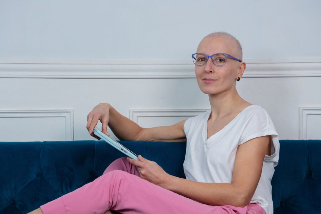 woamn with hair loss sitting on couch