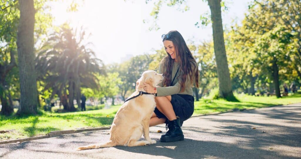 woman with her dog in the park