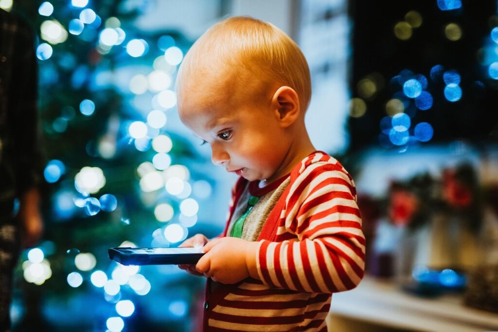 small child using phone