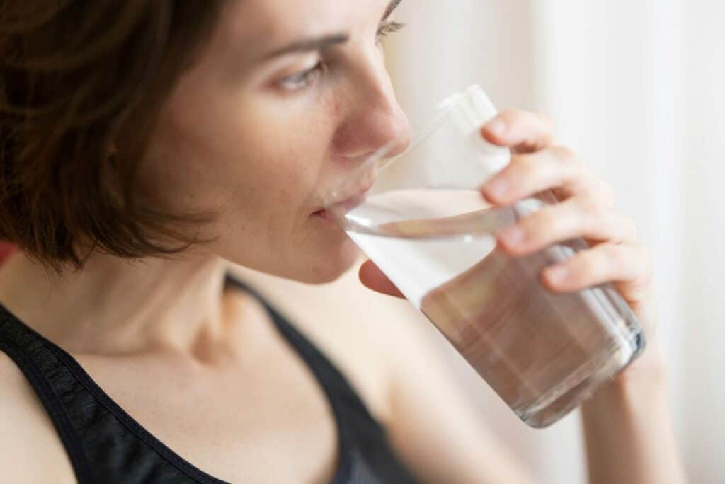 young woman drinking water