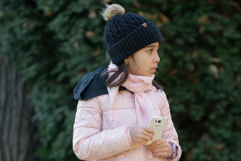 young girl using phone