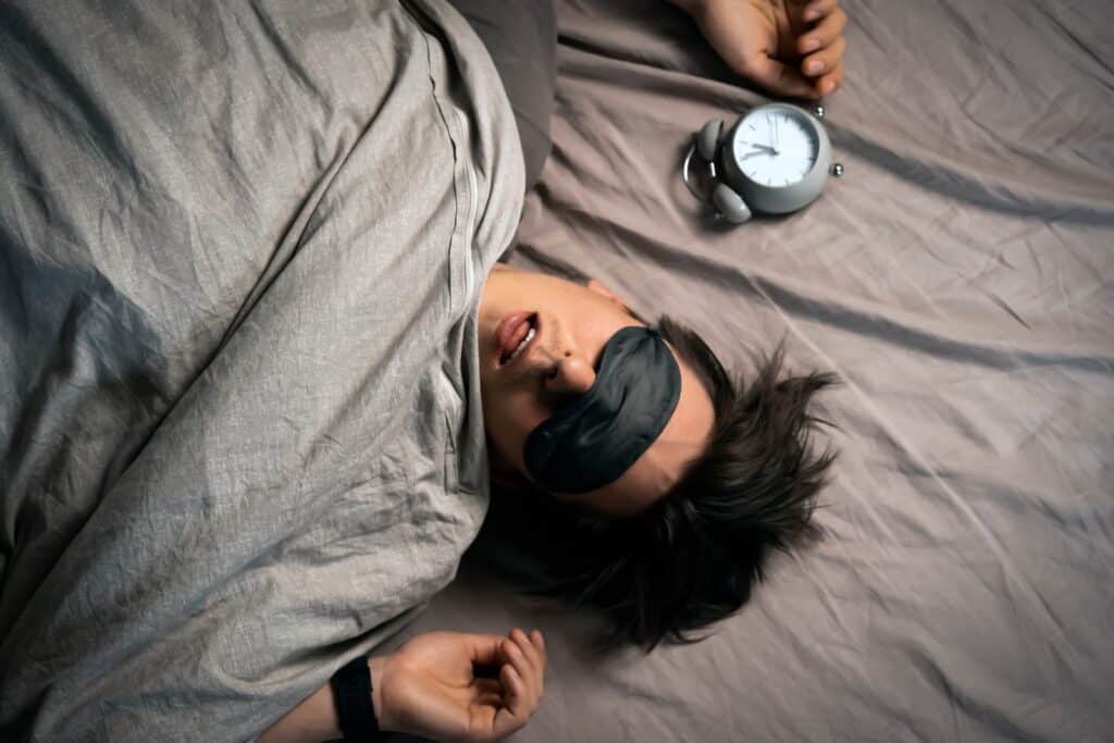 man asleep after taking melatonin