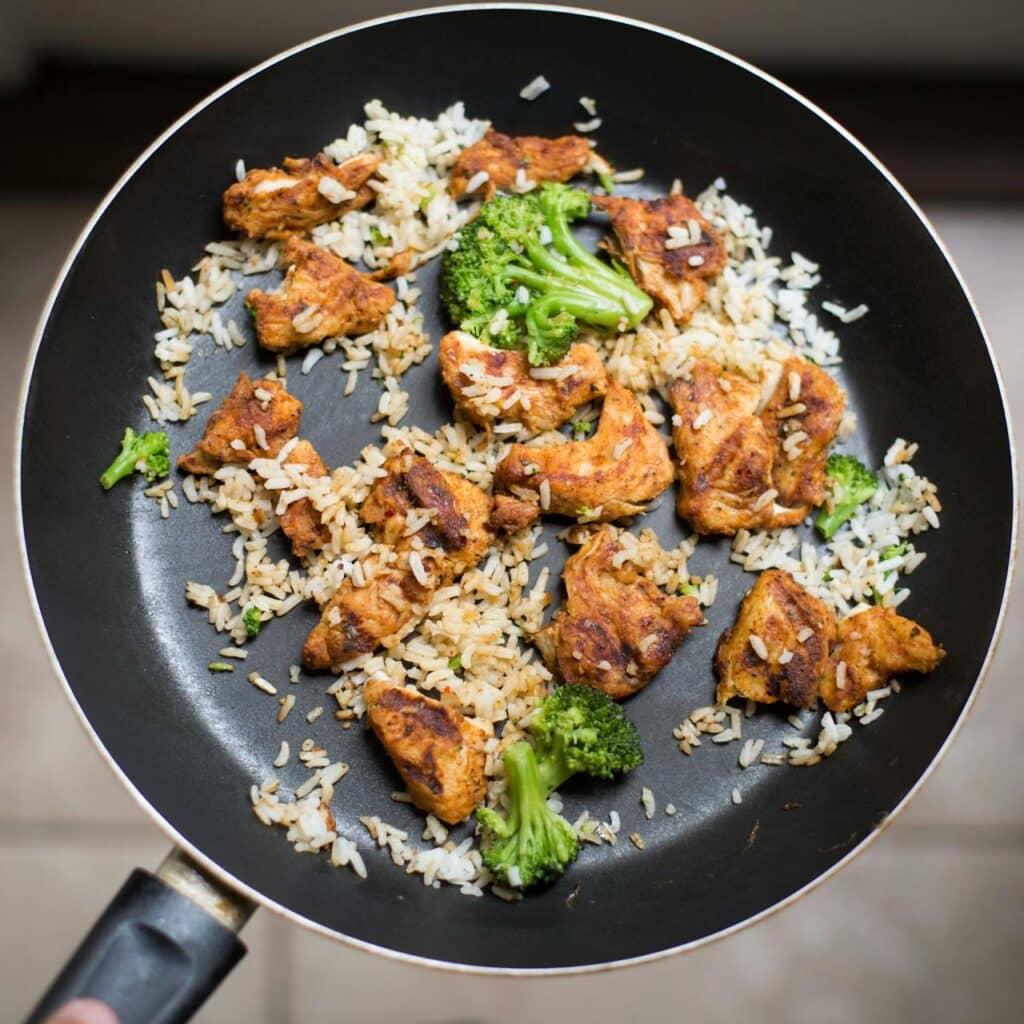 A one pan stirfry of chicken, rice and broccoli 