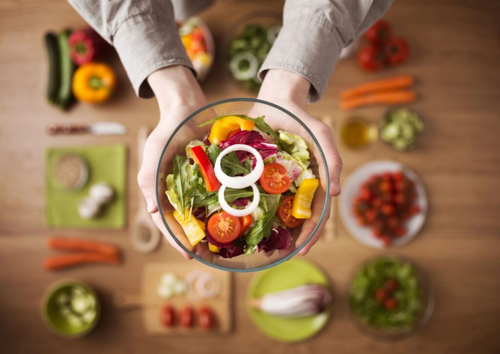 healthy meals idea, person holding a salad